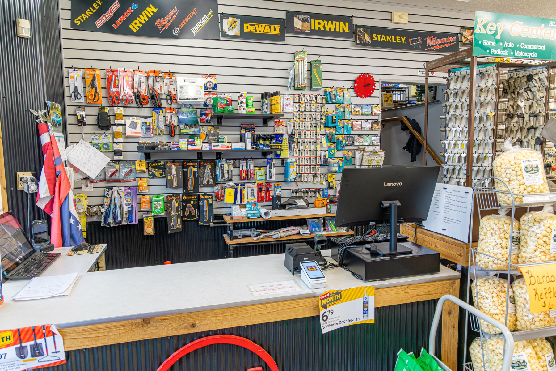 Behind the counter — keys, tags, and tool wall