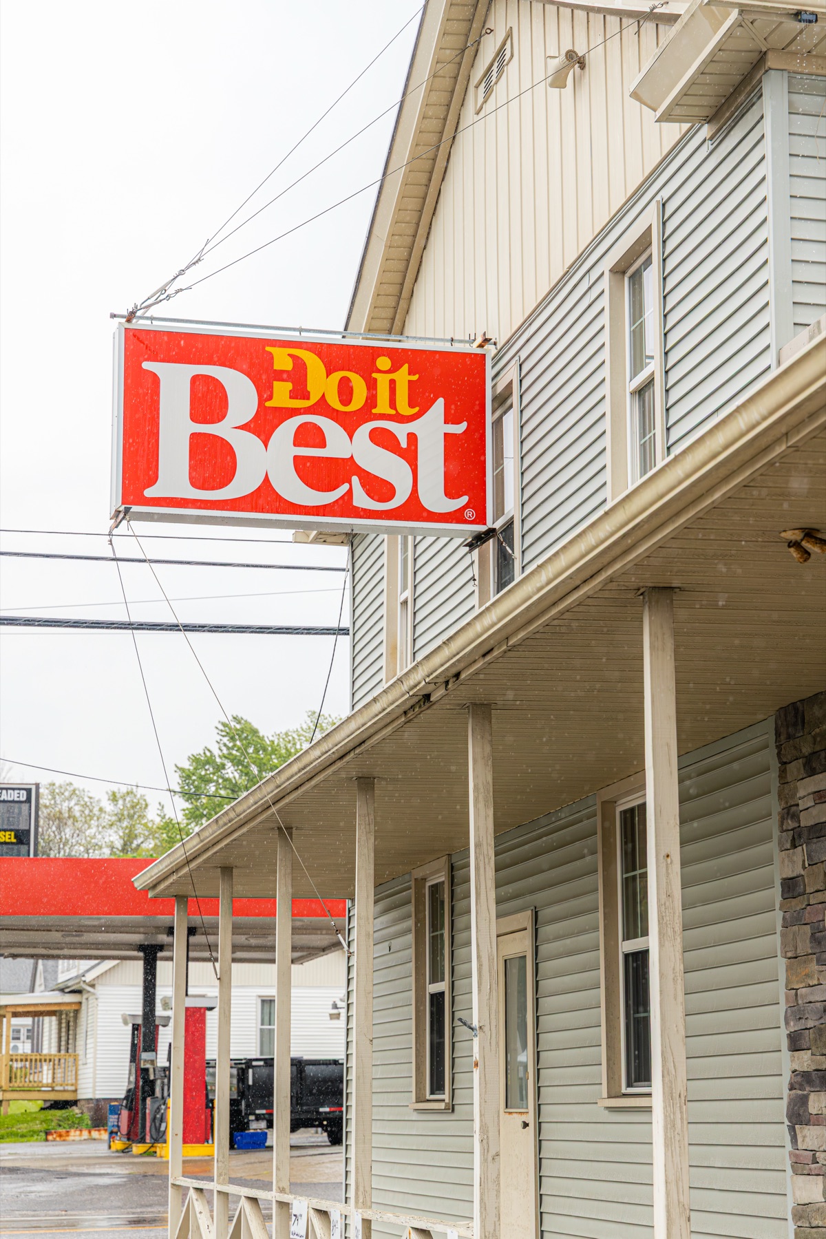 Do It Best sign against the painted siding